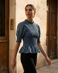Blouse péplum smockée à col volanté