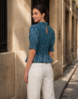 Blouse péplum smockée à col volanté
