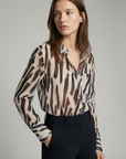 Chemise fluide imprimée zébrée beige et noir