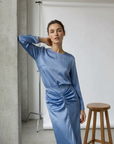 Blue satin ensemble with draped skirt, the perfect choice