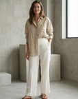 Pantalones de lino de cintura alta para mujer en blanco: elegantes y fluidos para el verano, ideales para la oficina y salidas.