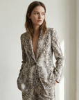 Pantalones Palazzo de pitón con estampado animal chic para mujer, cintura alta y sueltos para un estilo atrevido.