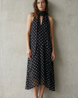 Robe noire fluide à pois blancs