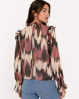 Dos blouse imprimée bouton et volants