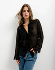 Chemisier noir transparent femme chic avec volants et manches longues en voile fluide