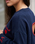 Pull détail LOVE aux poignets