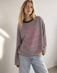 Top T shirt rayé manches longues « Believe »