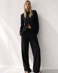 Veste noire à col montant croisée asymétrique