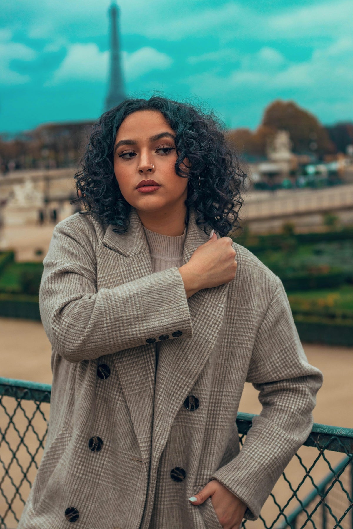 woman wearing gray trench coat