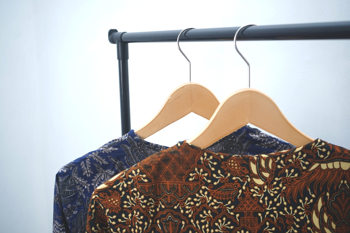 a woman's dress with a black and gold pattern