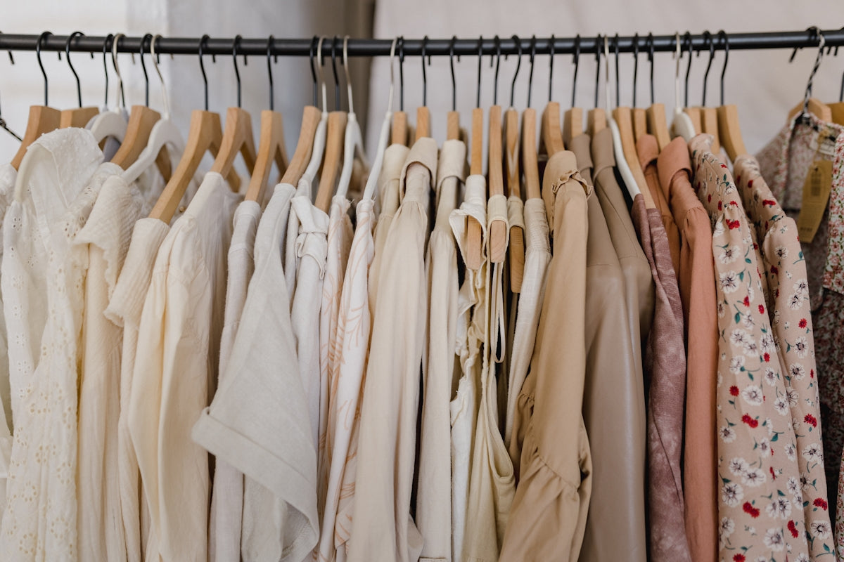 a rack of clothes hanging on a clothes rack