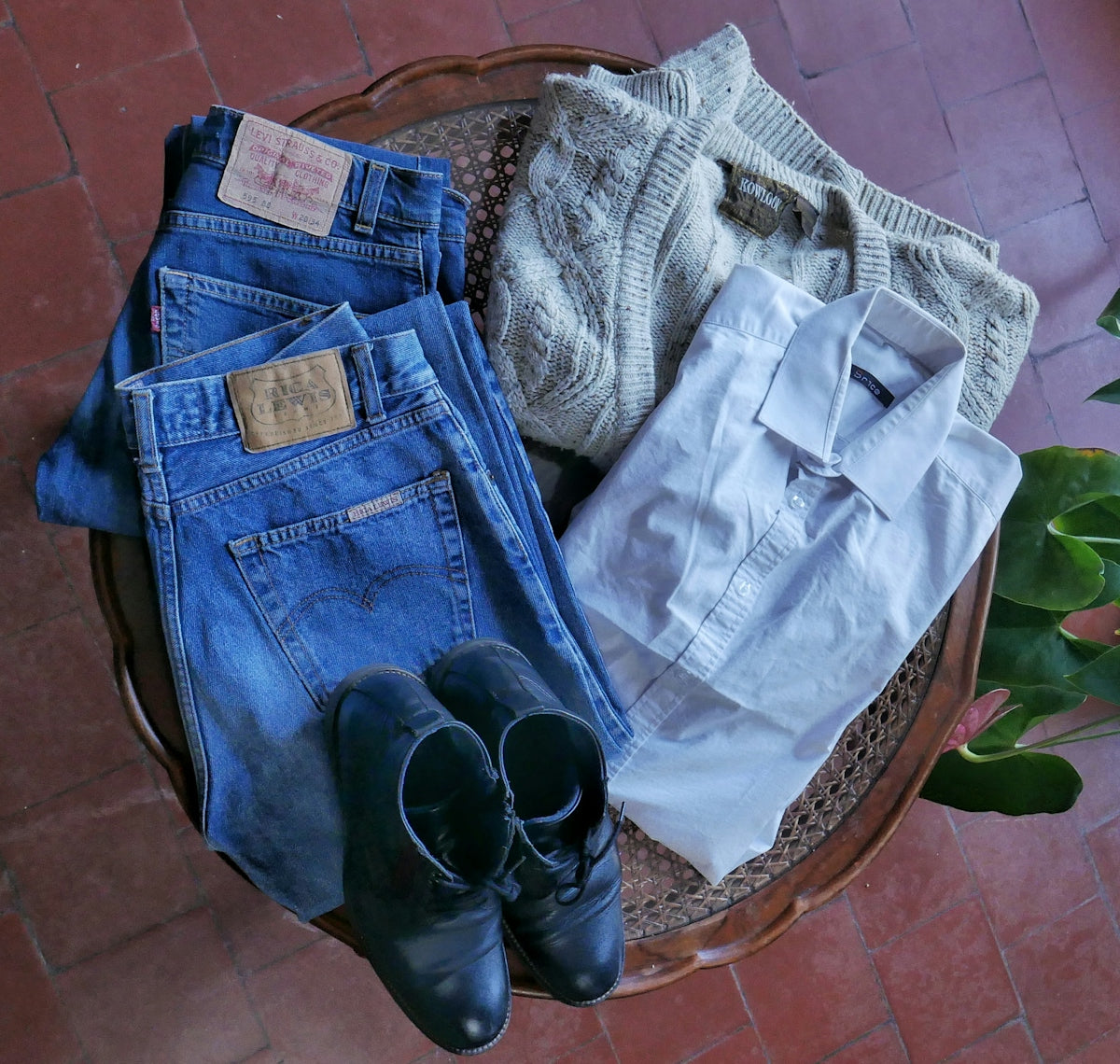 a basket filled with lots of different types of clothes