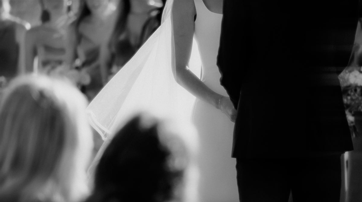 a black and white photo of a bride and groom