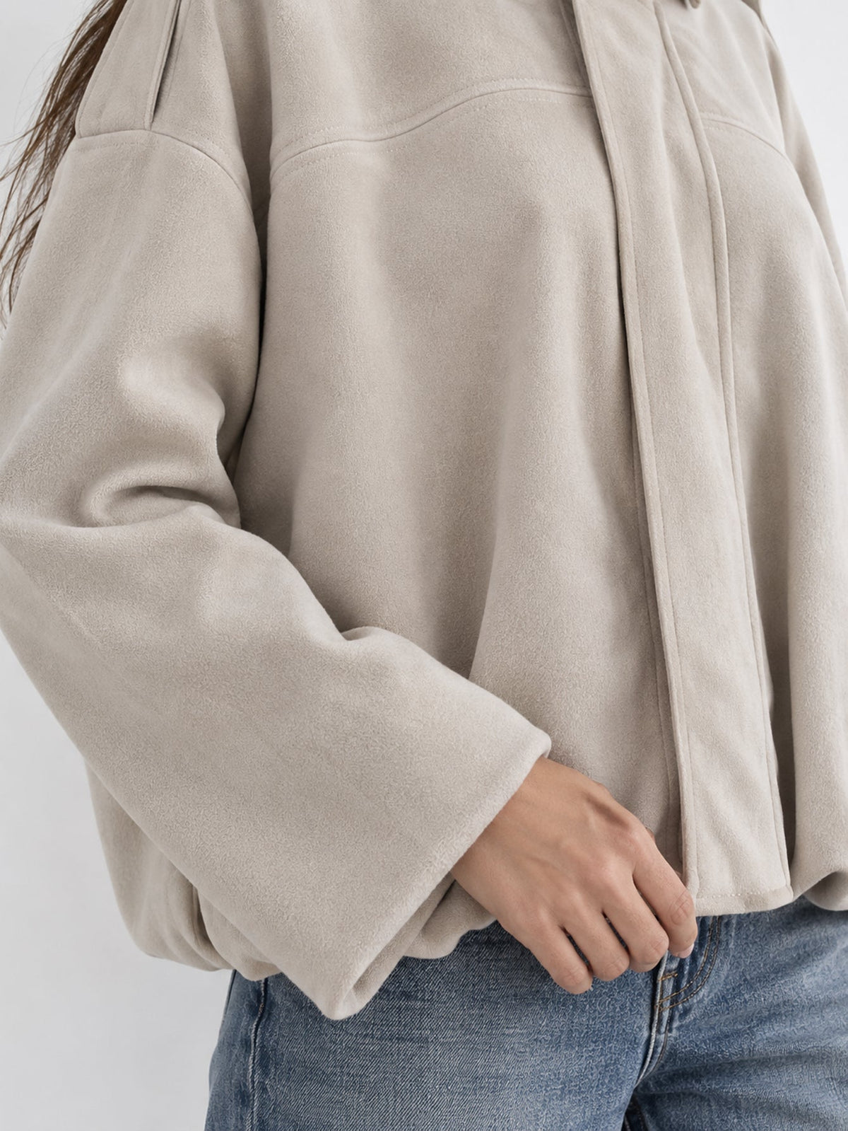 Détail manche et ourlet beige