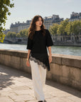 Top noir col rond à dentelle asymétrique