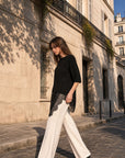 Top noir col rond à dentelle asymétrique