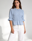 blouse à carreaux bleu clair col rond manches courtes
