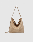 Sac à main simili cuir femme en couleur crème, parfait pour ajouter une touche chic à votre tenue.