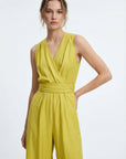 💛 Women's summer pistachio-colored fluid jumpsuit - chic, lightweight and crossed back