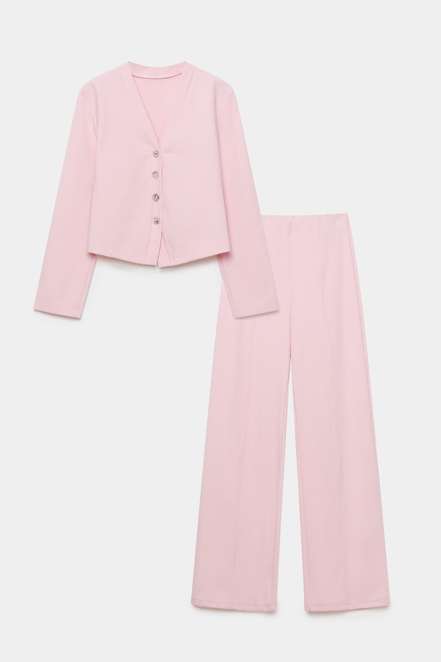 Image de l'ensemble deux pièces coton femme en rose, incluant une veste à col V et un pantalon large, sur fond blanc.