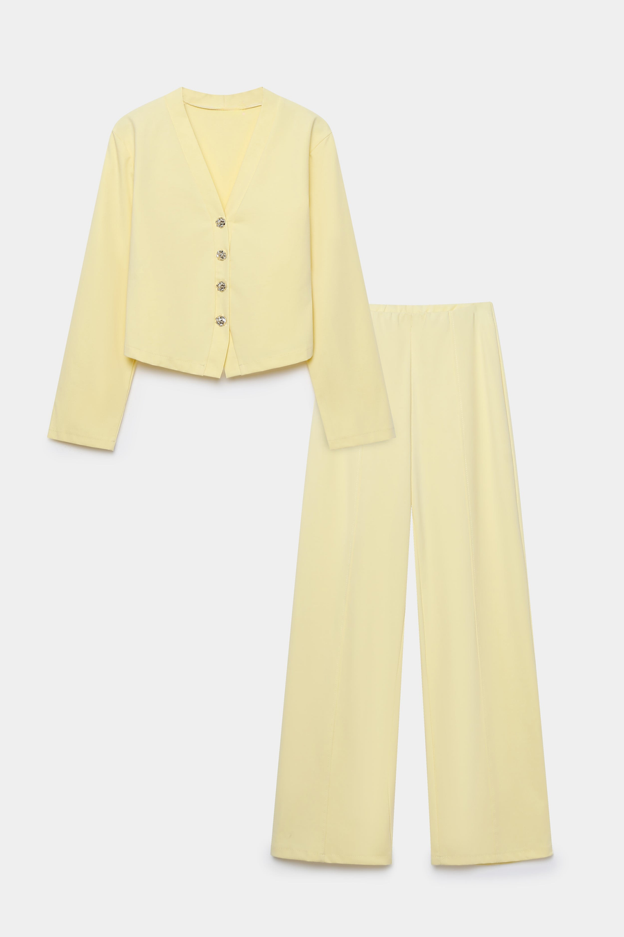 Image de l'ensemble deux pièces coton femme, incluant une veste à col V et un pantalon large, présentés sur fond blanc.
