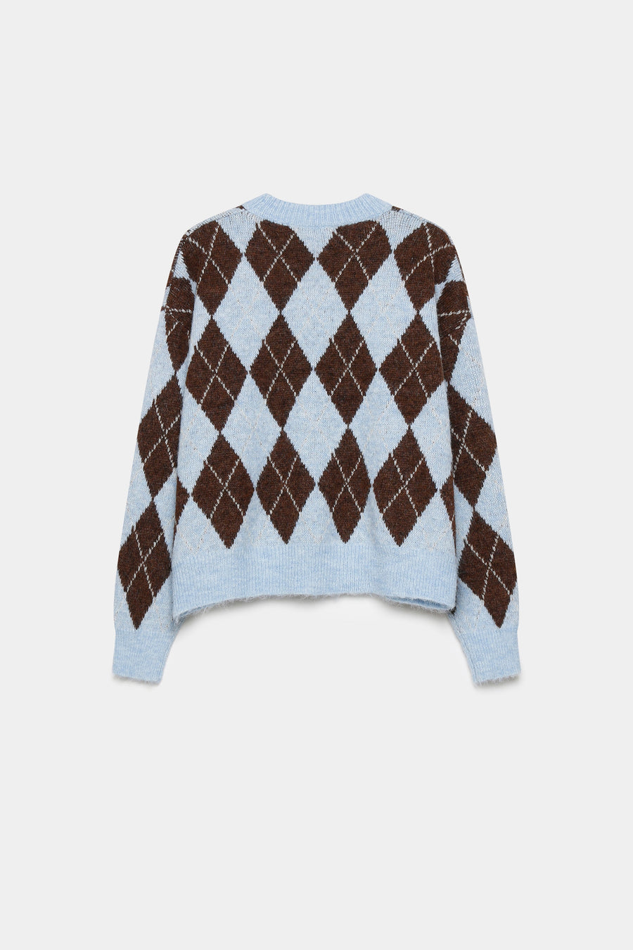 Détails du pull en maille femme à losanges, mettant en avant la coupe droite et les finitions en côtes.