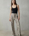 Pantalones Palazzo de pitón con estampado animal chic para mujer, cintura alta y sueltos para un estilo atrevido.