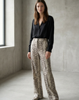 Pantalones Palazzo de pitón con estampado animal chic para mujer, cintura alta y sueltos para un estilo atrevido.