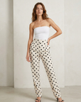 Pantalon fluide à pois noir blanc taille haute