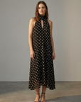 Robe noire fluide à pois blancs