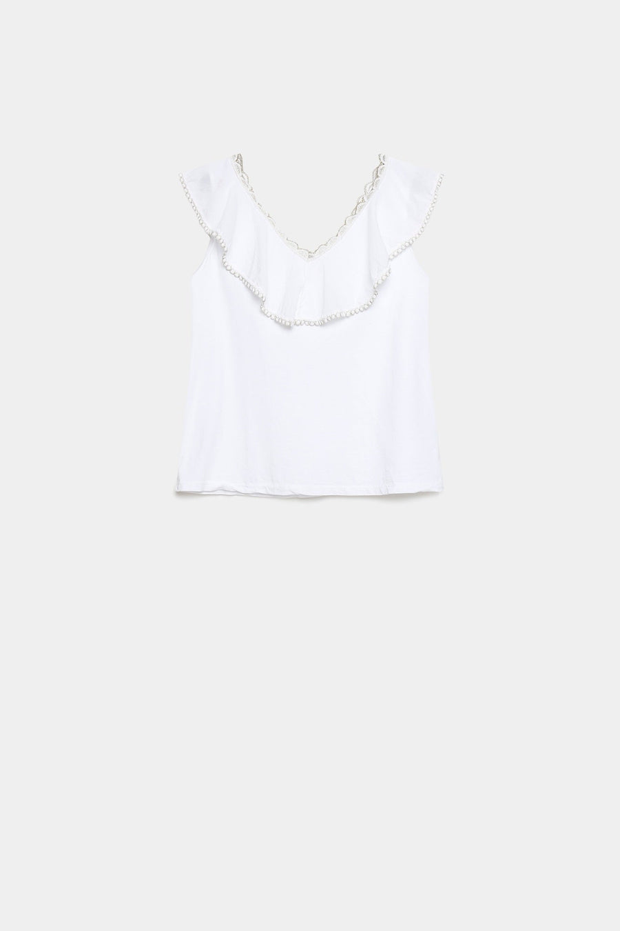 Top coton brodé volants femme en blanc, exposé à plat pour montrer son allure élégante et simple.