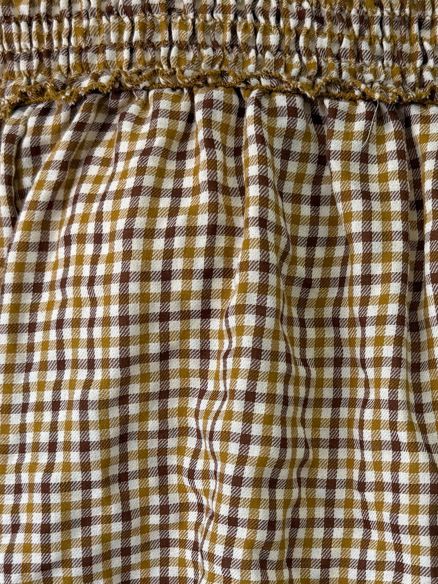 Zoom du tissu vichy moutarde