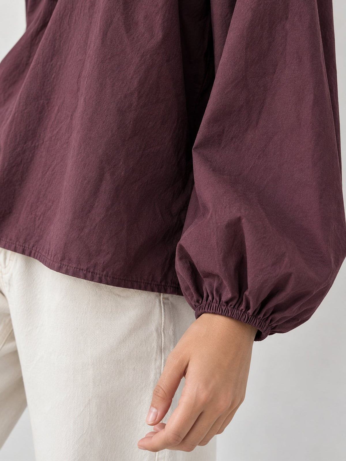 Manche bouffante prune et poignet élastiqué