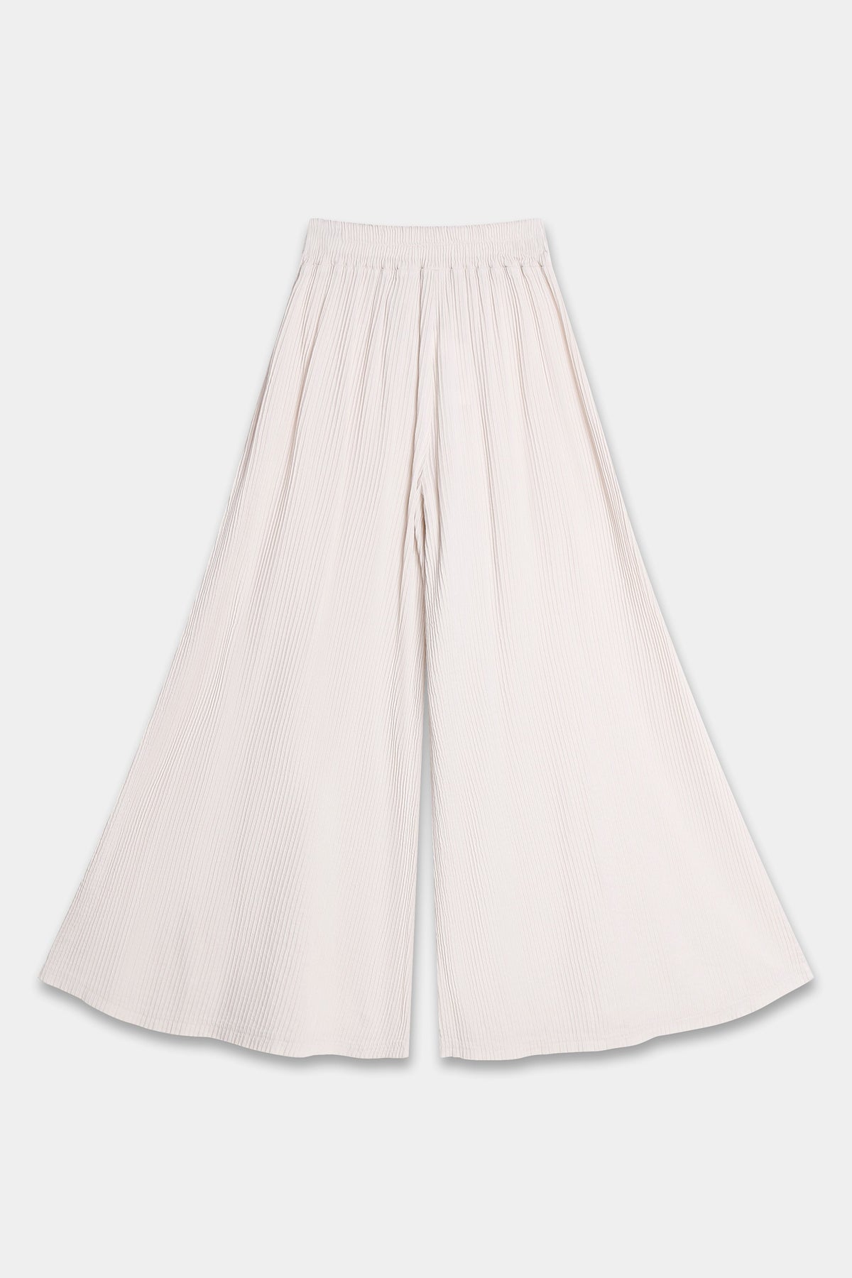 Pantalon palazzo beige vu de dos, ceinture élastiquée et jambes larges