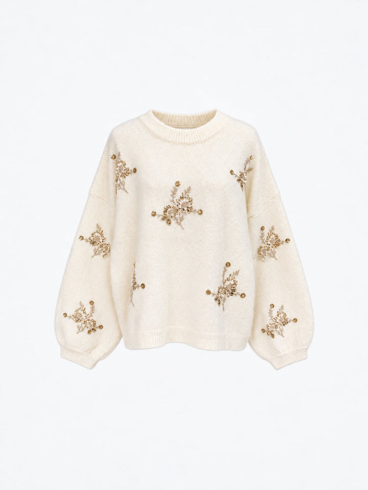 Pull en maille à perles et manches amples écru présenté de face.