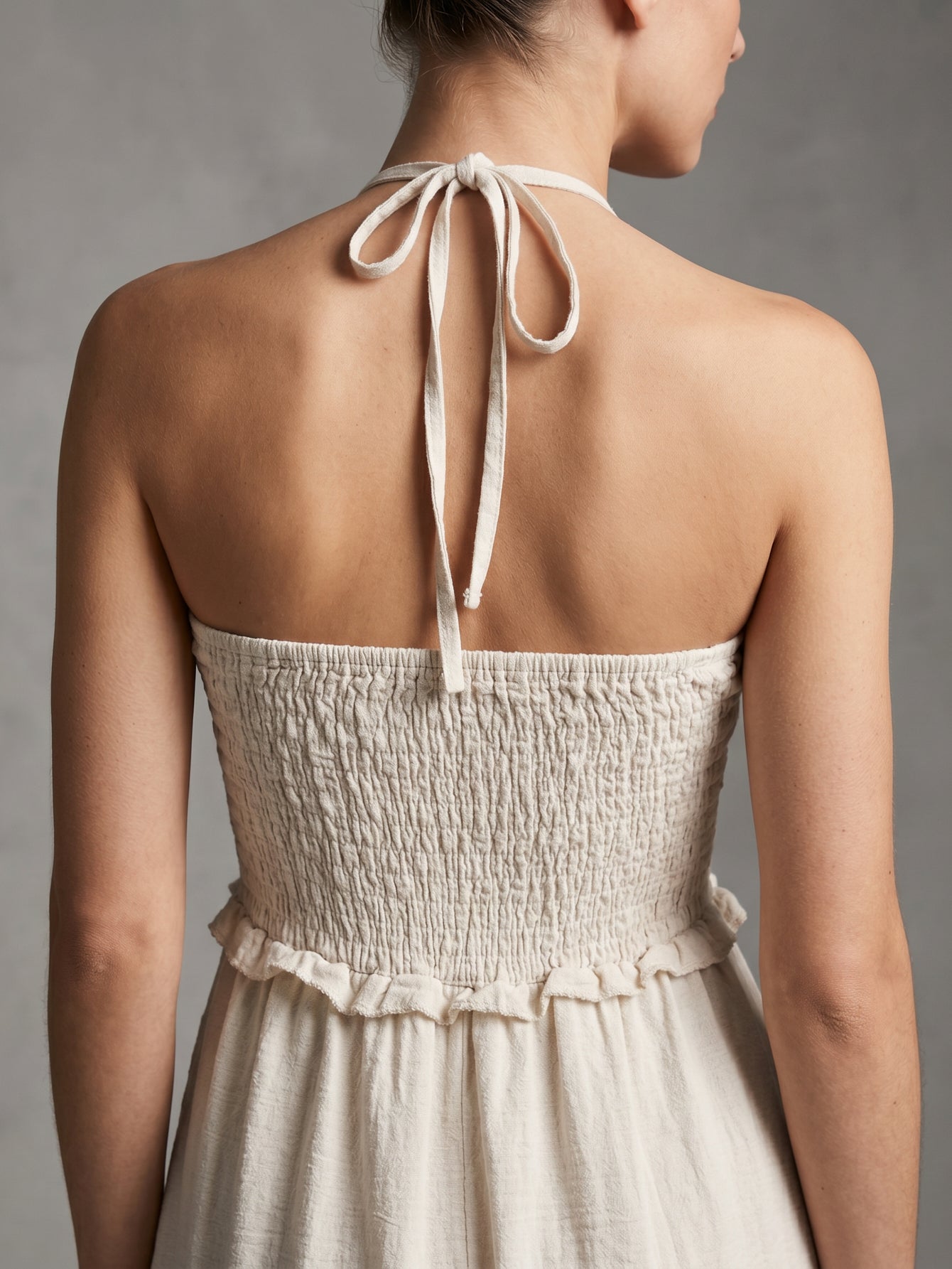 Détail dos smocké beige