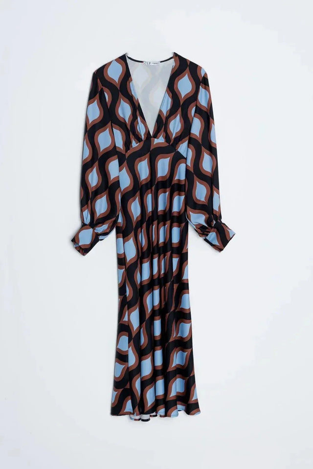 Robe motif géométrique midi, vue de dos, avec décolleté en V et manches bouffantes, soulignant sa coupe fluide.