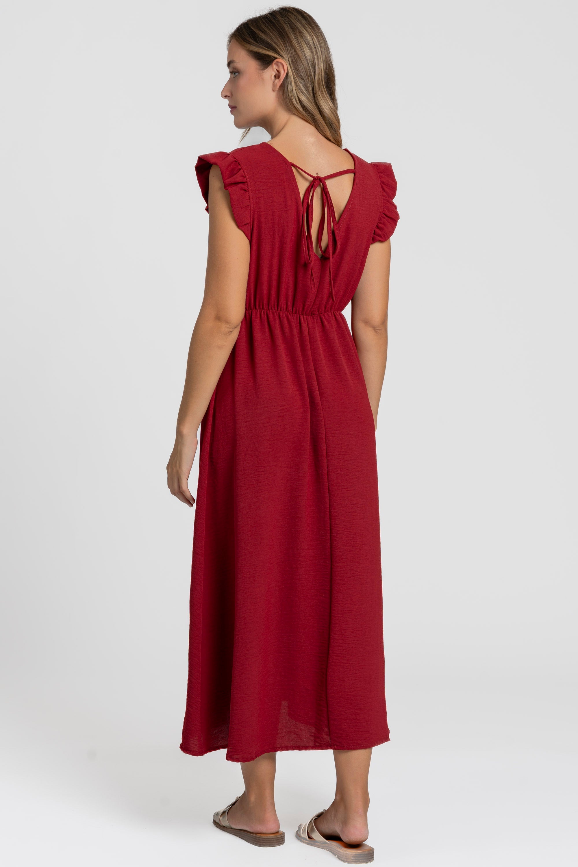 Robe midi fluide V-col sans manches taille élastique Italie, version rouge vue de dos.