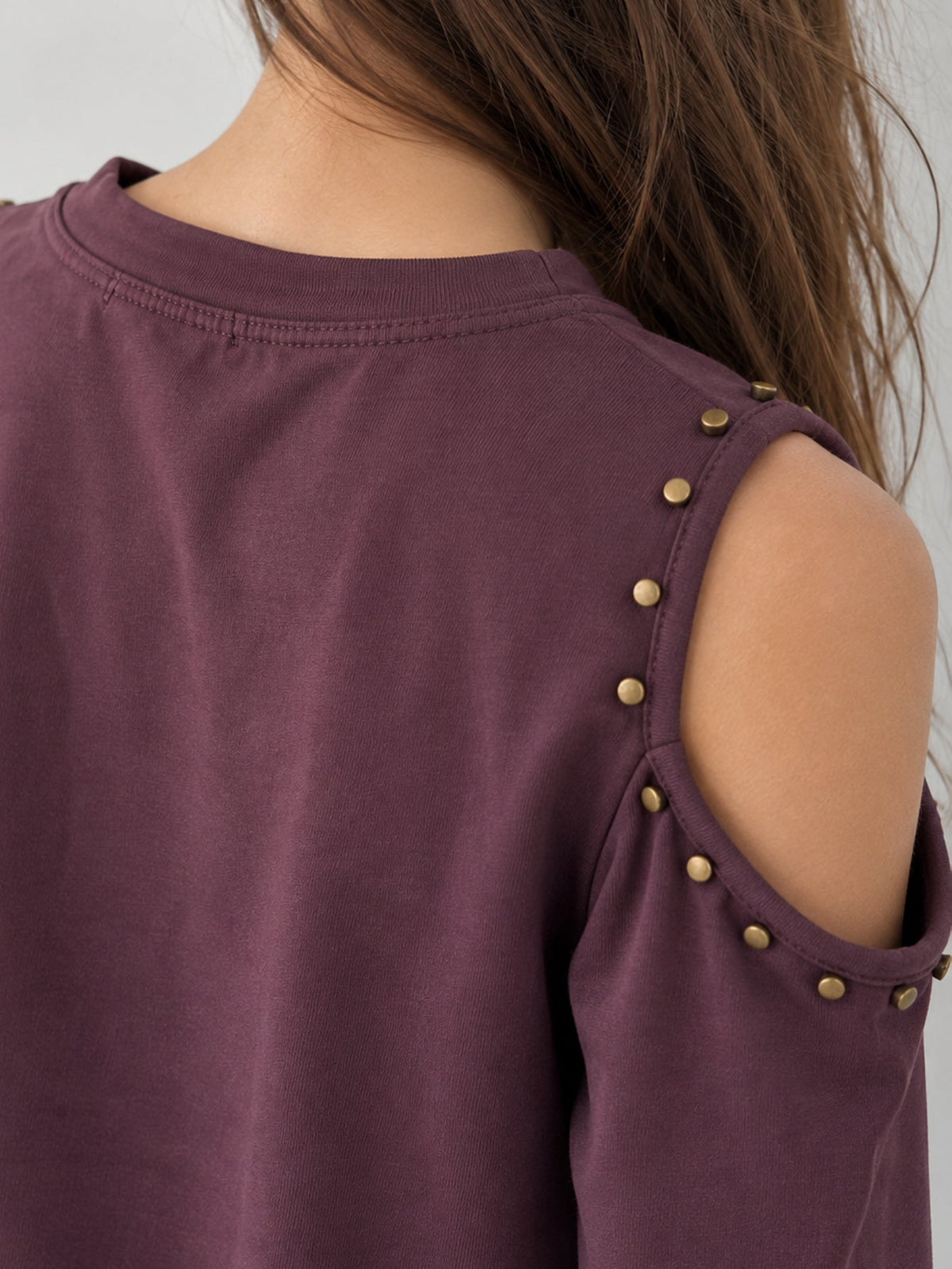 Détail rivets épaule prune