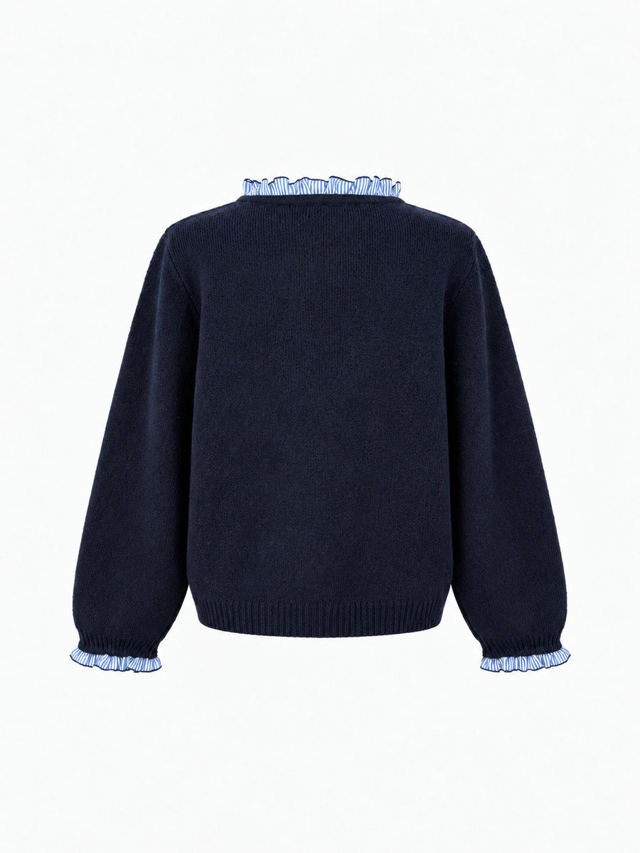 Veste en maille boutonnée à volants bleu nuit à volants bleus, présentée de dos.