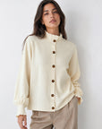 Cardigan boutonné beige col volanté