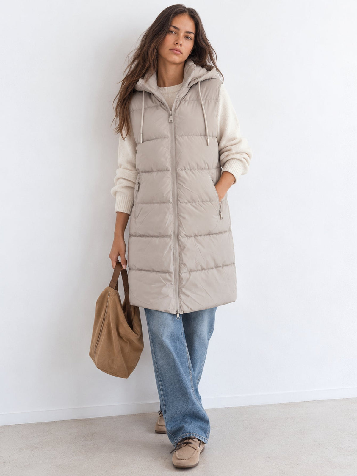 Gilet matelassé long beige à capuche